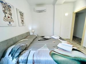 Postel nebo postele na pokoji v ubytování Magaggiari Reef