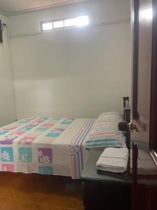 Voodi või voodid majutusasutuse Hospedaje Castillo Real toas