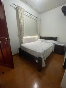 Voodi või voodid majutusasutuse Hospedaje Castillo Real toas