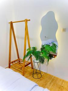 a bedroom with a bed and a mirror at Inplana Cabin in Tjiandjur +27 photos