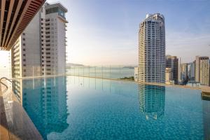 a swimming pool on the roof of a building at Gonsala Hotel Nha Trang in Nha Trang