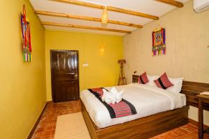Letto o letti in una camera di Nepali Heritage Hotel