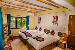 Letto o letti in una camera di Nepali Heritage Hotel