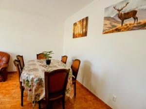 a dining room with a table and chairs at Casa Rocha Relax in Aljezur