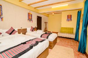 Letto o letti in una camera di Nepali Heritage Hotel