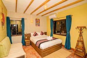 Letto o letti in una camera di Nepali Heritage Hotel