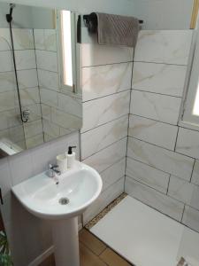 a bathroom with a sink and a shower at La Casita de Puerto in Puerto del Rosario +9 photos