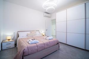 Postel nebo postele na pokoji v ubytování Capriè, dimora tra mare e monti