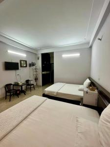 Postel nebo postele na pokoji v ubytování Khách sạn Hương Trà 1