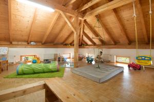 a large living room with a swing in a house at Ferienhof Schütz in Eschlkam