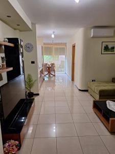a large living room with a couch and a table at Apartman Luka in Pula