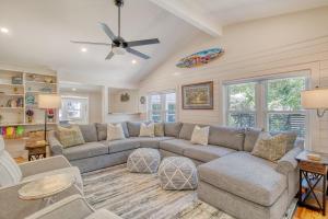 a living room with a couch and a ceiling fan at 116 E Hudson - Heaven's Folly - Private Pool - Central Location in Folly Beach