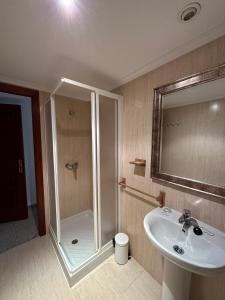 a bathroom with a shower and a sink at Hotel Angelito in O Grove +7 photos