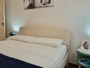 A bed or beds in a room at Nettuno 137D