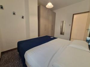 A bed or beds in a room at Nettuno 137D