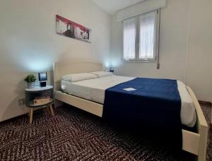 A bed or beds in a room at Nettuno 137D