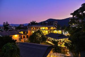 a large building with lights on at night at The Lakeside Retreat Pokhara By IME Hospitality in Pokhara