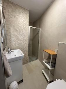 a bathroom with a sink and a shower at Apartmani Maksan in Pakoštane +111 photos