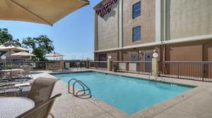 a swimming pool in front of a hotel at Hampton Inn Georgetown-Marina in Georgetown