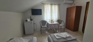 Μια τηλεόραση ή/και κέντρο ψυχαγωγίας στο Guest House Andrea +23 φωτογραφίες