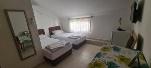 Ένα ή περισσότερα κρεβάτια σε δωμάτιο στο Guest House Andrea