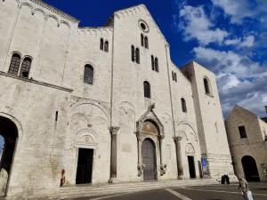 a large stone church with a large building at La Cas d Zii la Giulia in Bari +10 photos