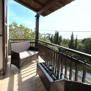 a balcony with a table and chairs and a view at Golden View Apartments in Arillas +32 photos