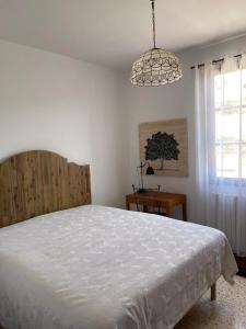 Łóżko lub łóżka w pokoju w obiekcie Maison accueillante avec vue sur la mer à Grosseto-Prugna