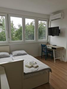 En eller flere senge i et værelse på Apartment Luna in Biograd center