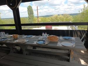 a table with plates of food on top at LídRind porta in Zalaszentgrót +20 photos