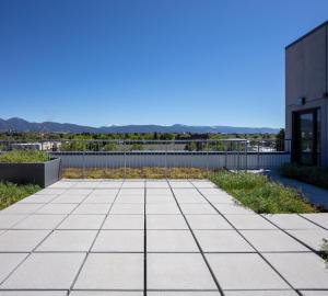 a patio on the roof of a building at Gorgeous Midtown Condo in Bozeman