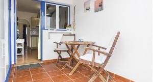 a dining room with a table and two chairs at El sombrerito 5 in Caleta de Sebo