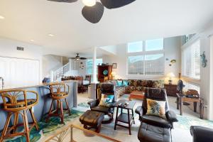 a living room with a couch and chairs at Ali'i Cove Y1 in Kailua-Kona