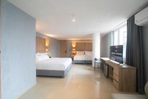 Postel nebo postele na pokoji v ubytování Mood Matuna Hotel Cartagena