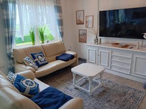 Μια τηλεόραση ή/και κέντρο ψυχαγωγίας στο Haus Marilene - familienfreundlich, gemütlich, unvergesslich