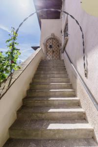 a set of stairs leading up to a door at Appartamenti VERDE ACQUA in Pergine Valsugana