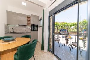 a kitchen and dining room with a table and chairs at Villa Dana in Bar