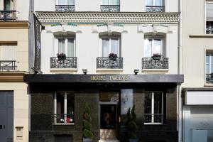 a hotel in paris with a sign that reads hotel twelve at Hotel Le Twelve in Paris