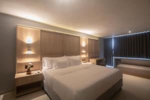 Postel nebo postele na pokoji v ubytování Mood Matuna Hotel Cartagena