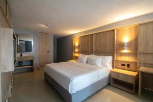 Postel nebo postele na pokoji v ubytování Mood Matuna Hotel Cartagena
