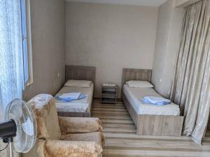 Letto o letti in una camera di Tsisa House