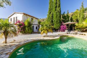 Bazén v ubytování Finca El Capricho nebo v jeho okolí