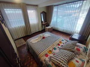 a hotel room with a bed with a towel on it at MATRIMONIAL TURI centro de la ciudad, garaje in Baños