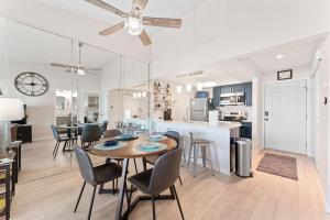 a dining room and kitchen with a table and chairs at Oasis on Table Rock Lake in Kimberling City