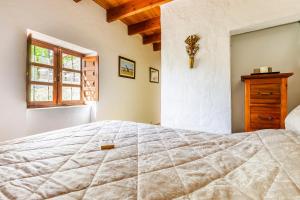 Postel nebo postele na pokoji v ubytování Finca El Capricho