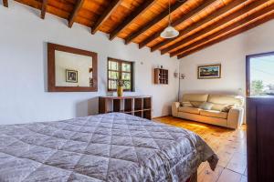 Postel nebo postele na pokoji v ubytování Finca El Capricho
