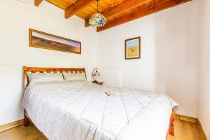 Postel nebo postele na pokoji v ubytování Finca El Capricho