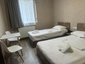 Postel nebo postele na pokoji v ubytování Hotel Skib