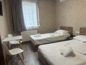 Postel nebo postele na pokoji v ubytování Hotel Skib