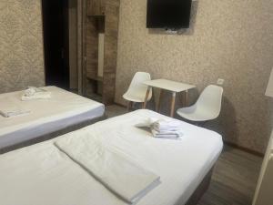 Postel nebo postele na pokoji v ubytování Hotel Skib